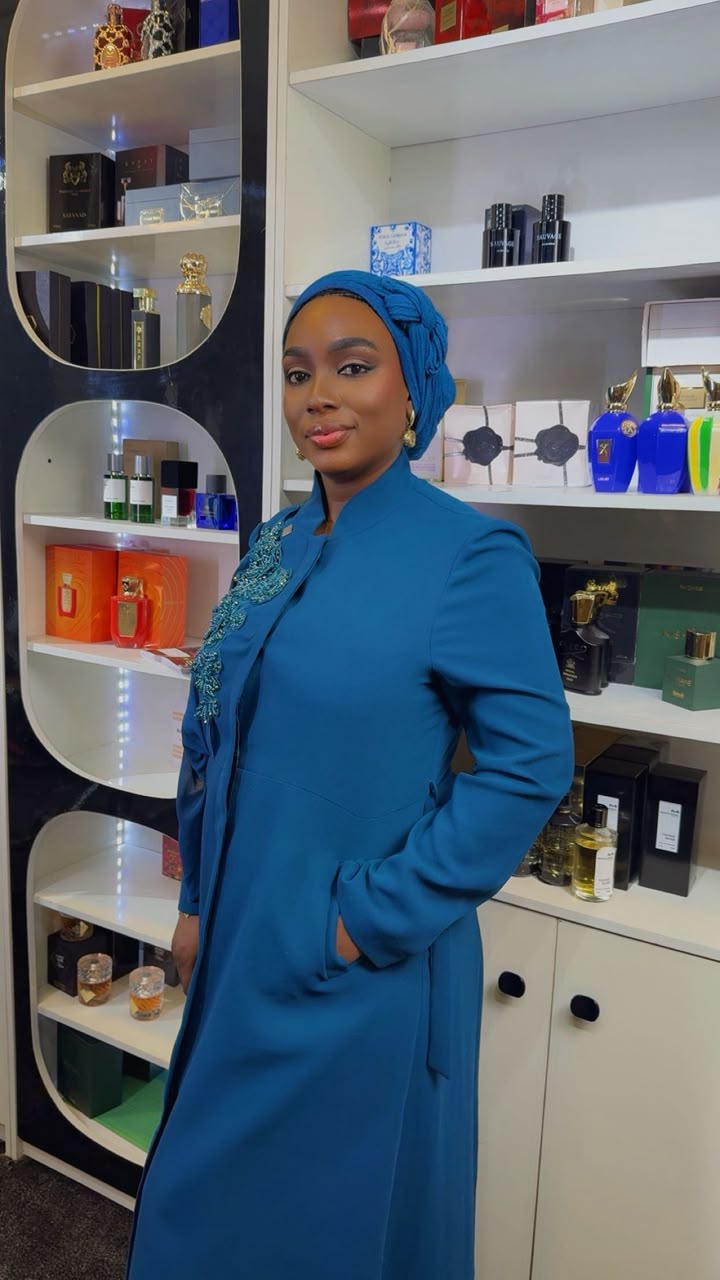 Hadiza, founder of Perfect Scents, in the store surrounded by designer stock